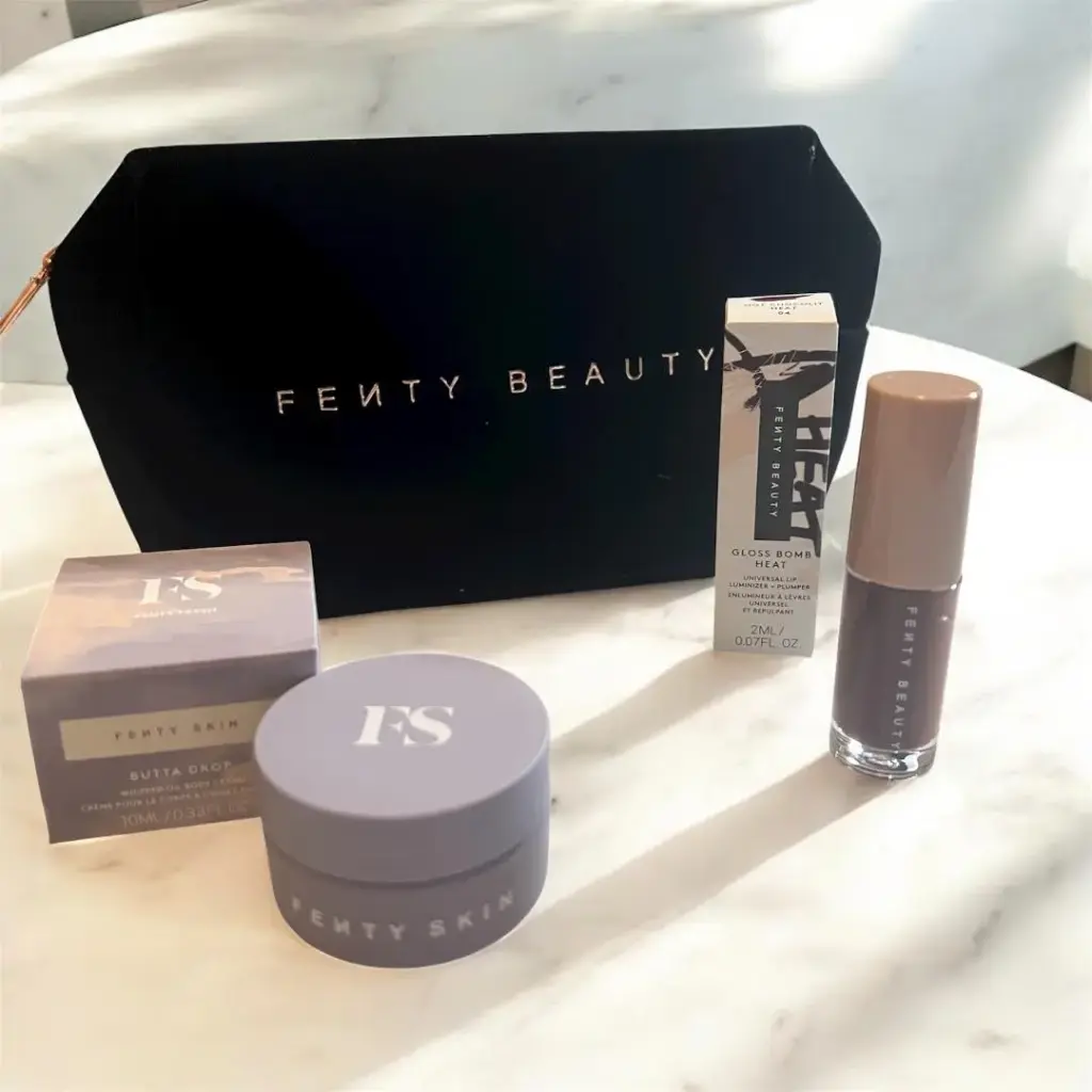 Fenty Beauty black makeup bag includes Fenty skin butta drop body cream mini ,Gloss Bomb Heat Hot chocolate plumper 