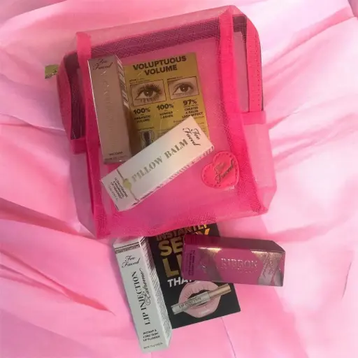 Too Faced Mini 4 piece set (mini better than sex , ribbon wrapped lash , pillow balm , lip injection ) in a mesh bag 